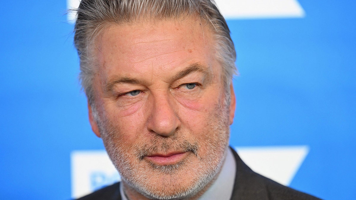 Alec Baldwin has a serious look on his face as he looks away from the camera while attending the Robert F. Kennedy Human Rights Ripple of Hope Award Gala