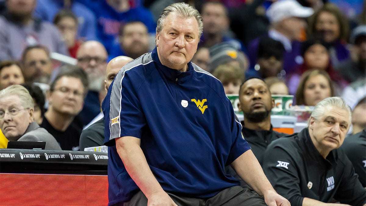 Bob Huggins coaches during the Big 12 Tournament