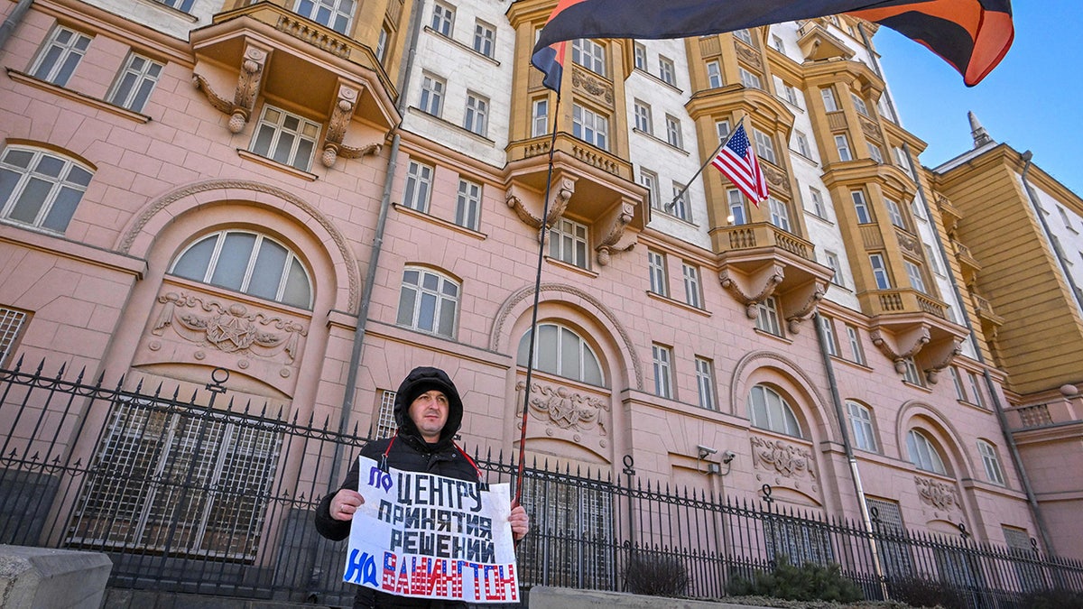 American embassy in Moscow with Russian protester outside