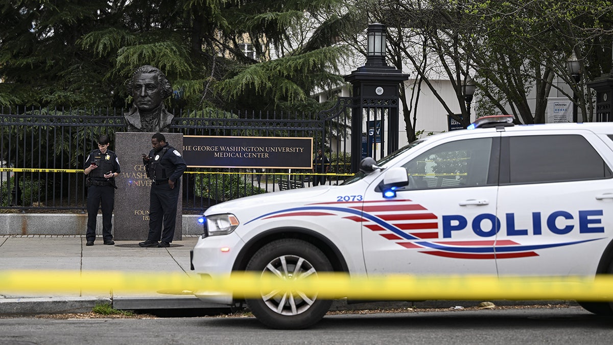 DC police cruiser behind police tape