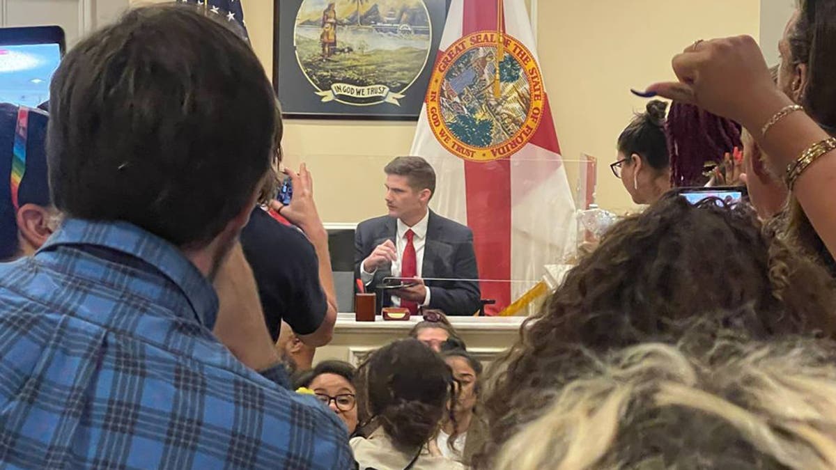 Florida protesters gather at DeSantis office