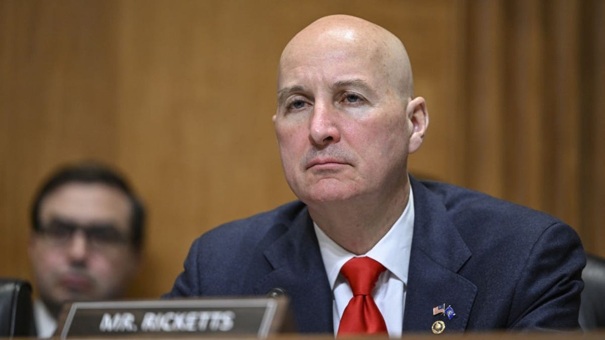 Pete Ricketts wearing a suit and tie