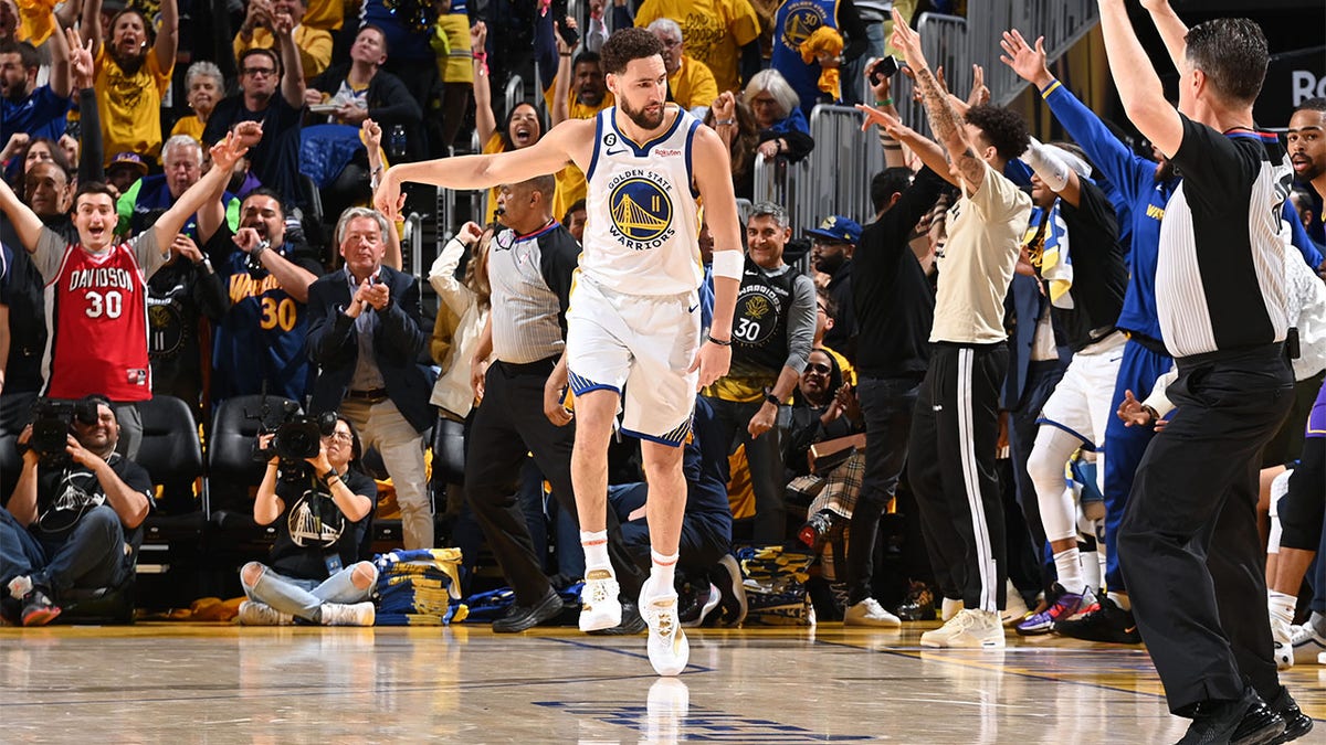 Klay Thompson celebrates after hitting a shot