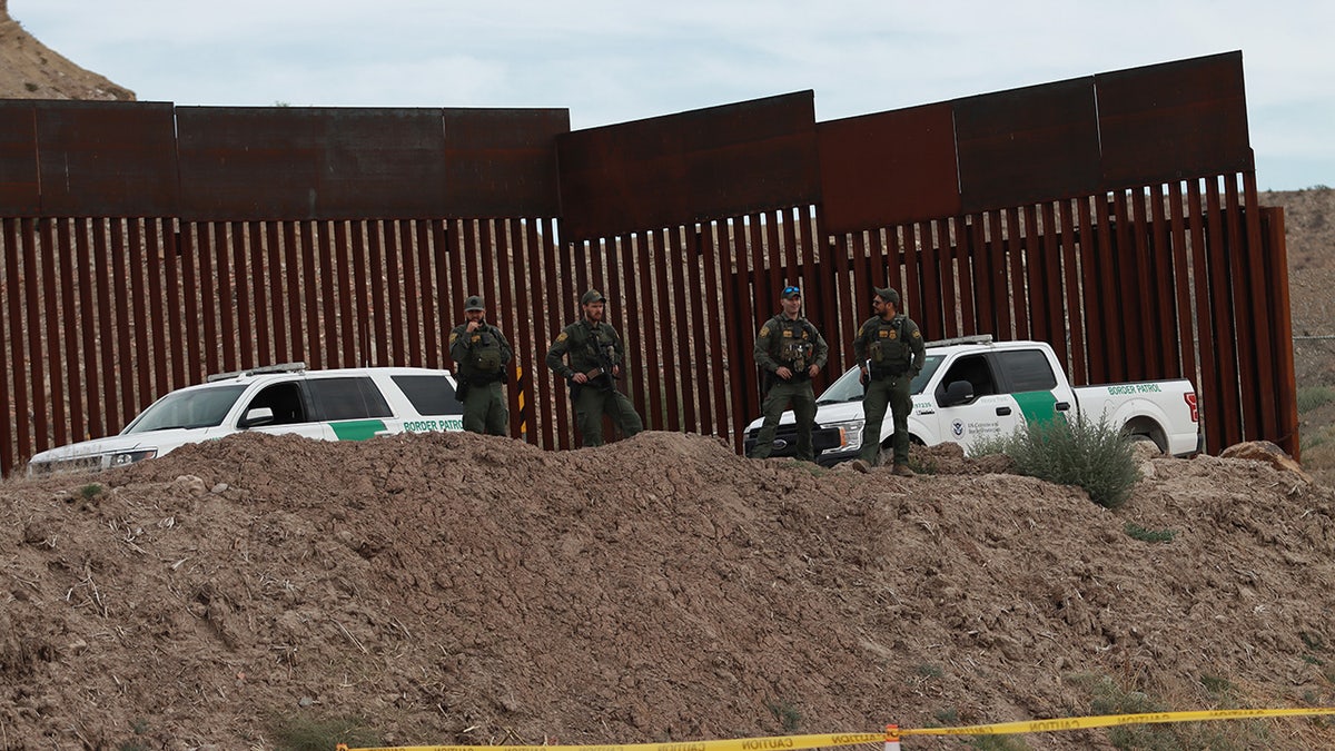 Border patrol stand by "Hugs Not Walls" event