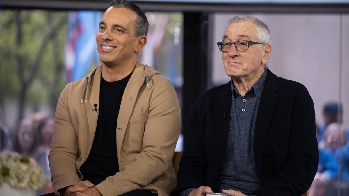 Sebastian Maniscalco and Robert De Niro sit next to each other during an interview.