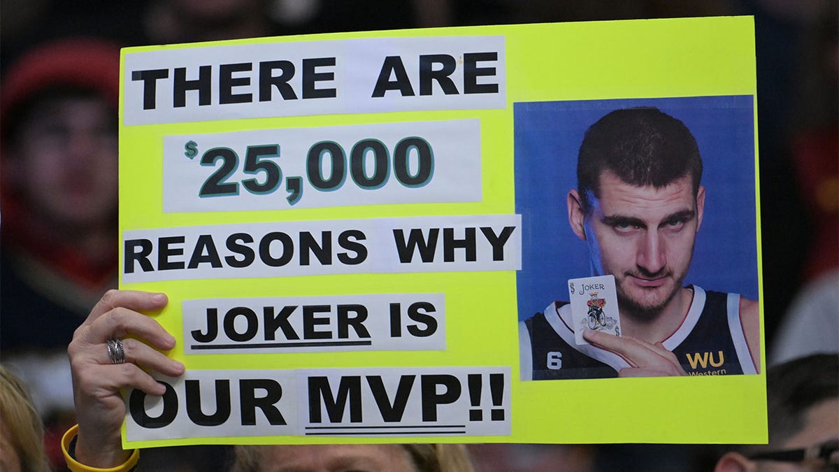 A fan holds a sign for Nikola Jokic