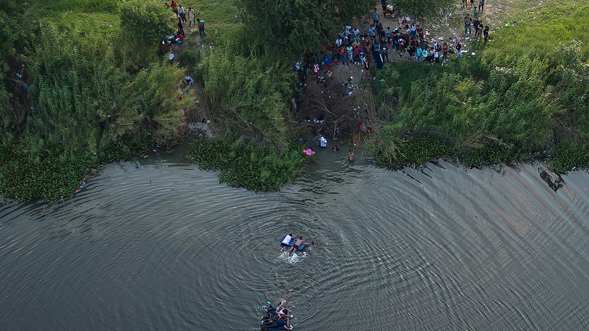 An aerial photo of migrants in water