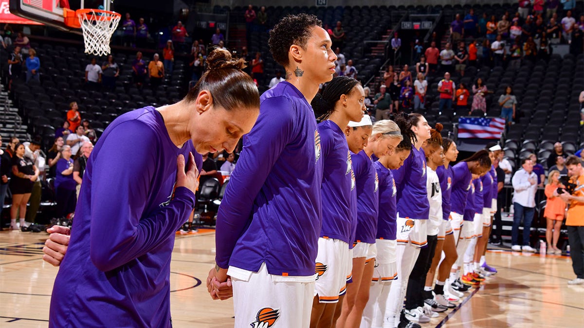 The Phoenix Mercury stand for the national anthem