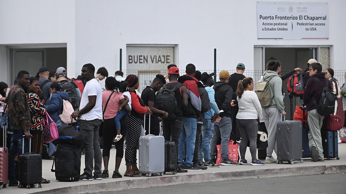 Migrants surge at California border port of entry