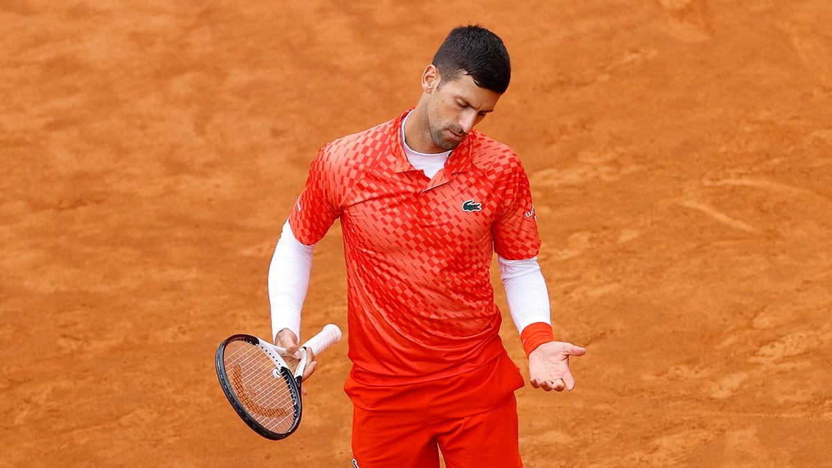 Novak Djokovic reacts to his play during the quarterfinal match at the Italian Open