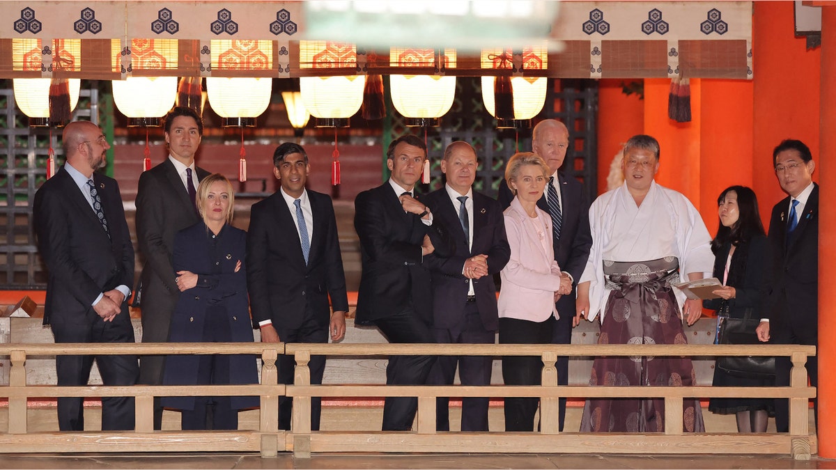 (L to R) European Council President Charles Michel, Canada's Prime Minister Justin Trudeau, Italy's Prime Minister Giorgia Meloni, Britain's Prime Minister Rishi Sunak, France's President Emmanuel Macron, Germany's Chancellor Olaf Scholz, European Commission President Ursula von der Leyen, US President Joe Biden and Japan's Prime Minister Fumio Kishida (R) pay a visit to Itsukushima Shrine on Miyajima island, near Hiroshima, during the G7 Summit Leaders' Meeting on May 19, 2023.