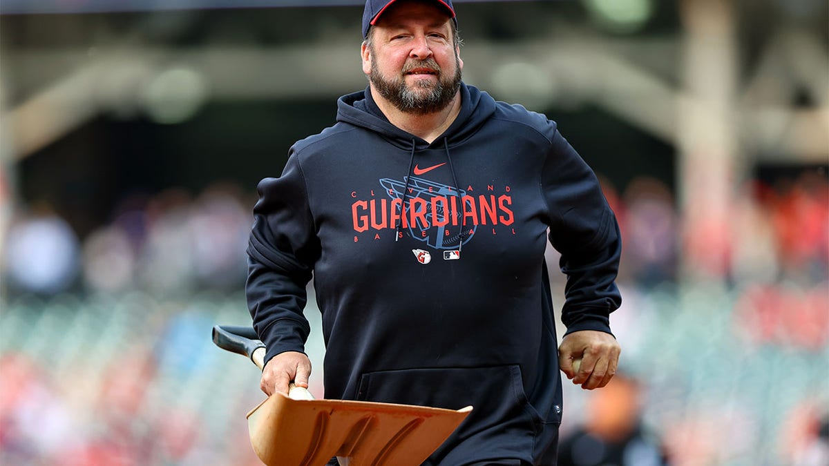 A member of the Cleveland groundcrew removed a bird