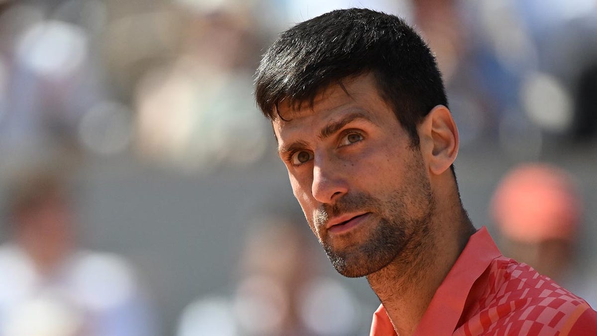 Novak Djokovic plays during the first round of the French Open