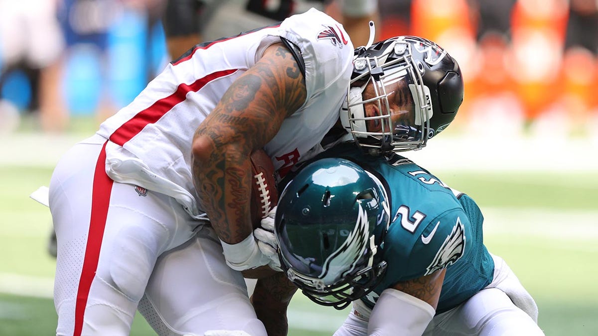 Kieth Smith gets hit by Darius Slay during an NFL game