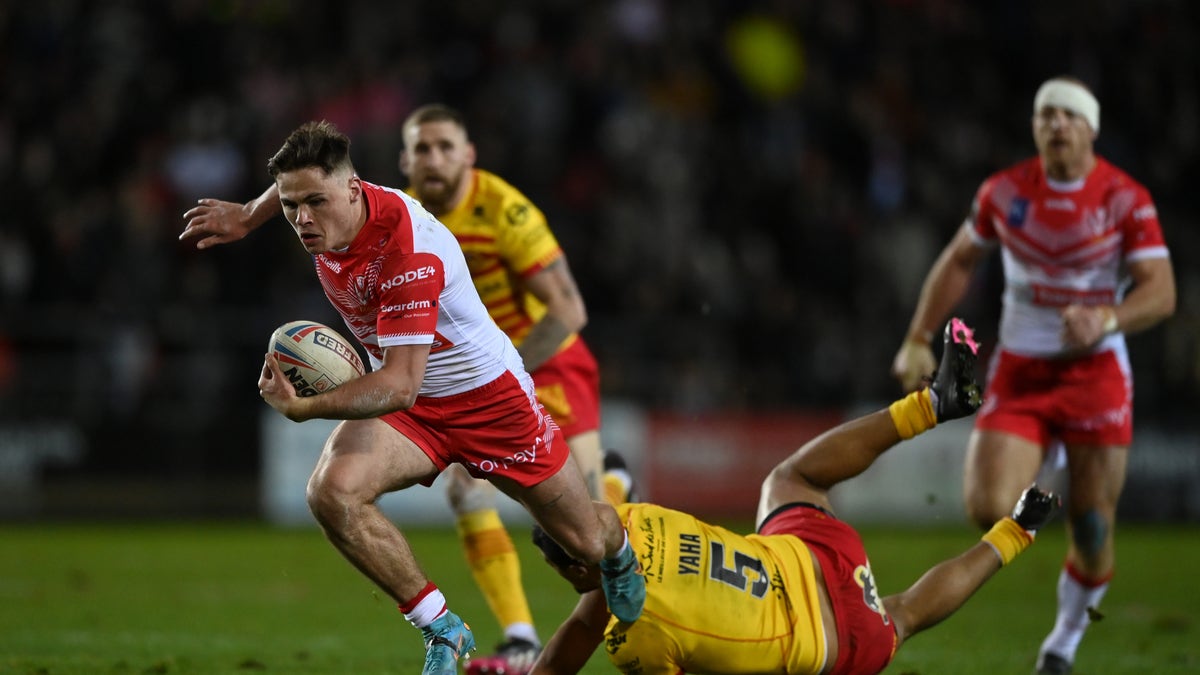 St Helens player breaks a tackle 