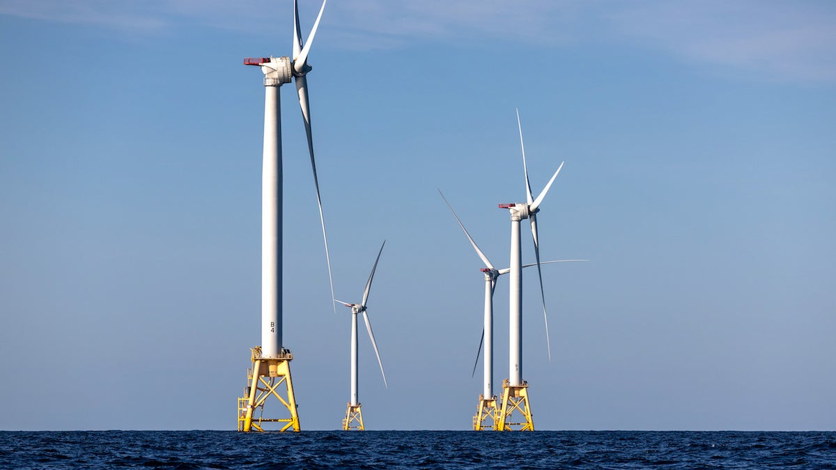 AT SEA - JULY 07: Wind turbines generate electricity at the Block Island Wind Farm on July 07, 2022 near Block Island, Rhode Island. The first commercial offshore wind farm in the United States is located 3.8 miles from Block Island, Rhode Island in the Atlantic Ocean. The five-turbine, 30 MW project was developed by Deepwater Wind and began operations in December, 2016 at a cost of nearly $300 million. (Photo by John Moore/Getty Images)