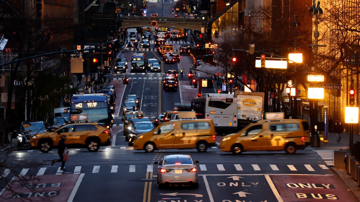 NEW YORK, NY - DECEMBER 8: Taxi cabs cross 42nd Steet as the sun rises on December 8, 2022, in New York City. (Photo by Gary Hershorn/Getty Images)