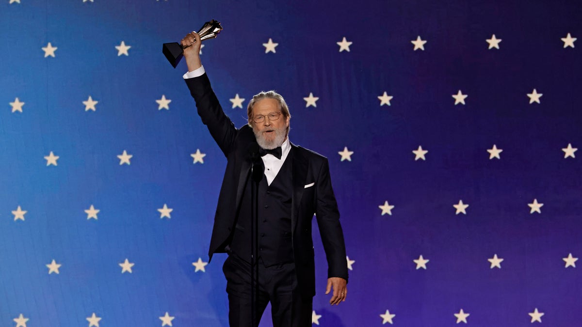 Jeff Bridges holds up Critics Choice Lifetime Achievement award