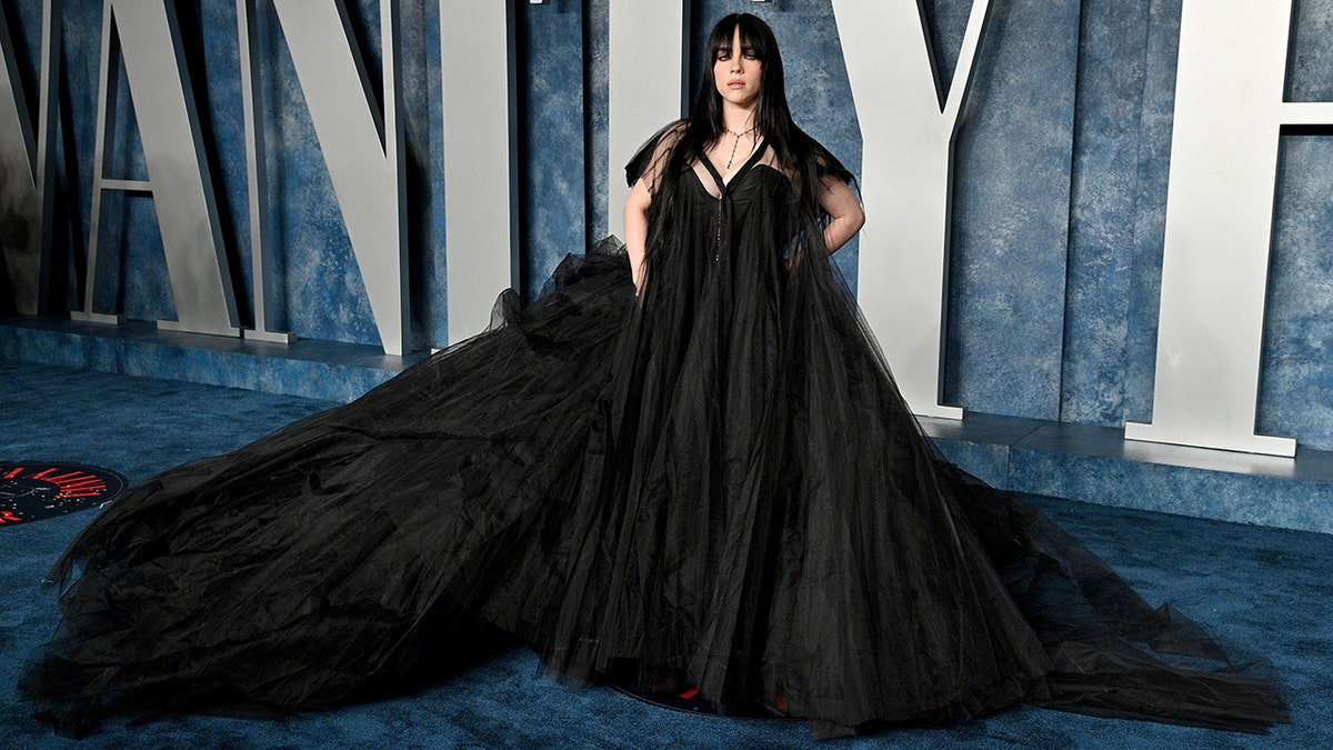 Billie Eilish in a flaring black gown on the Vanity Fair red carpet for the Oscars after party
