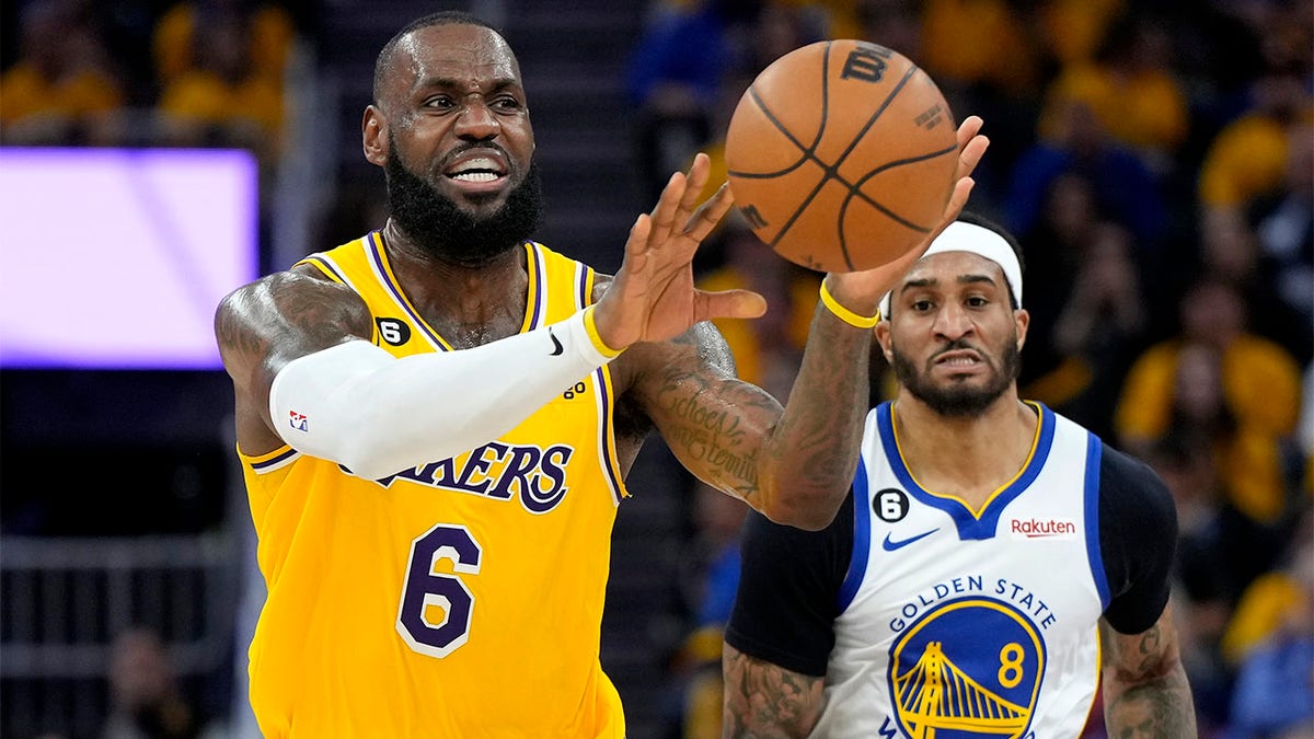 LeBron James passes the ball against the Warriors