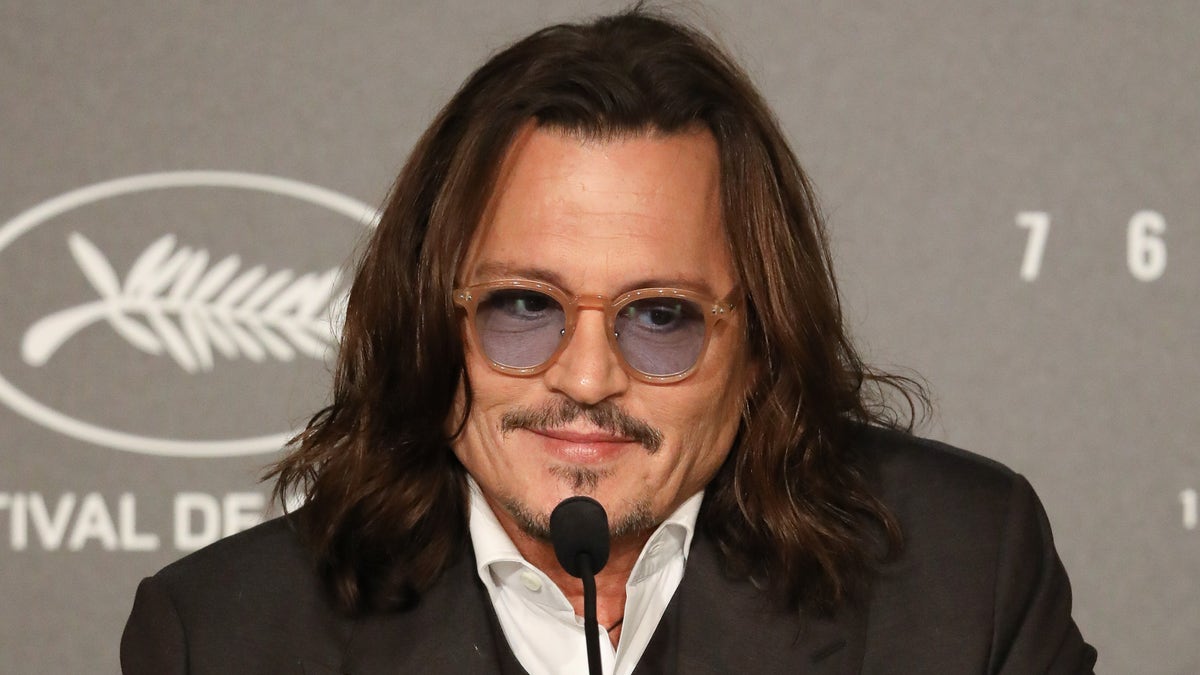 Johnny Depp wearing sunglasses at the Jeanne du Barry press conference