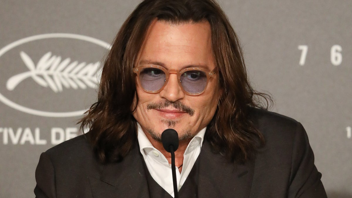 Johnny Depp wearing sunglasses at the Jeanne du Barry press conference