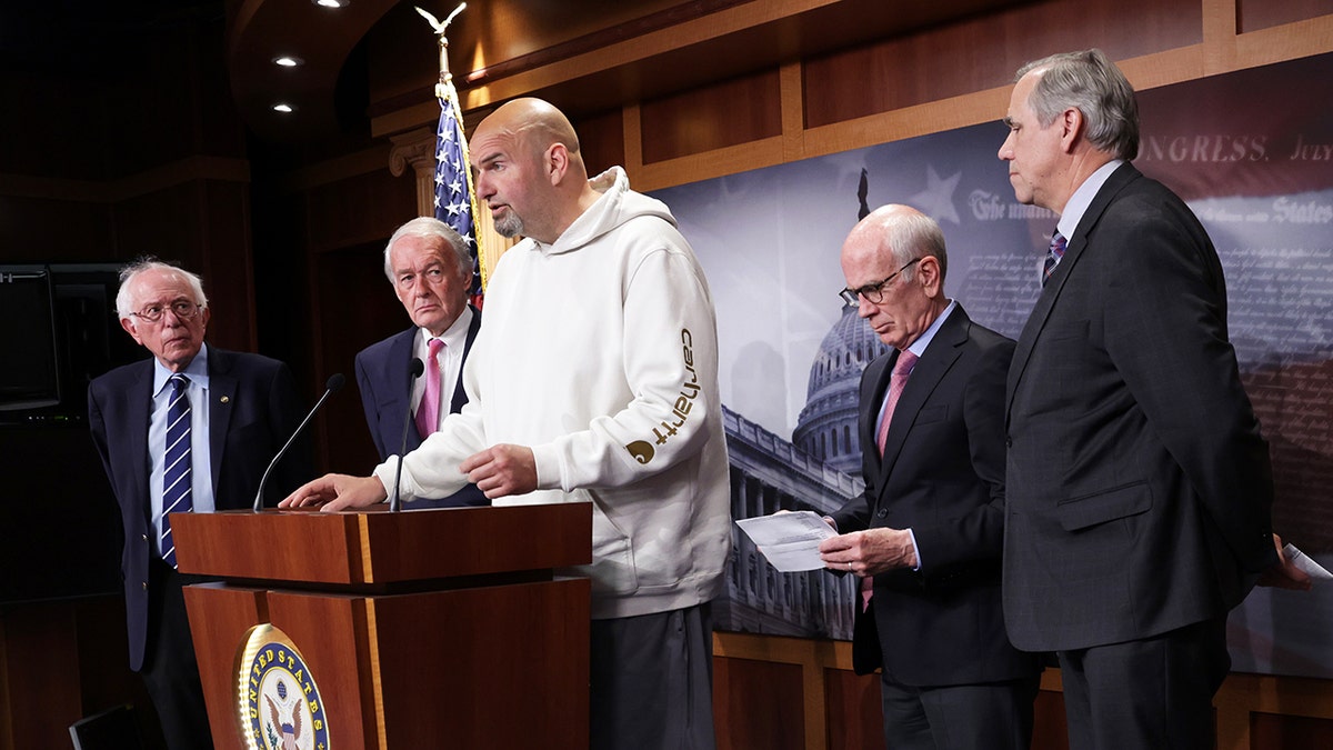 Sen. John Fetterman wore a white hoodie during a news conference on debt limit at the U.S. Capitol on May 18, 2023 in Washington, DC.