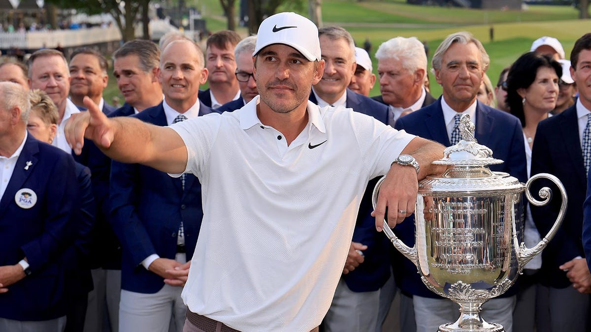 Brooks Koepka poses with the PGA Championship trophy