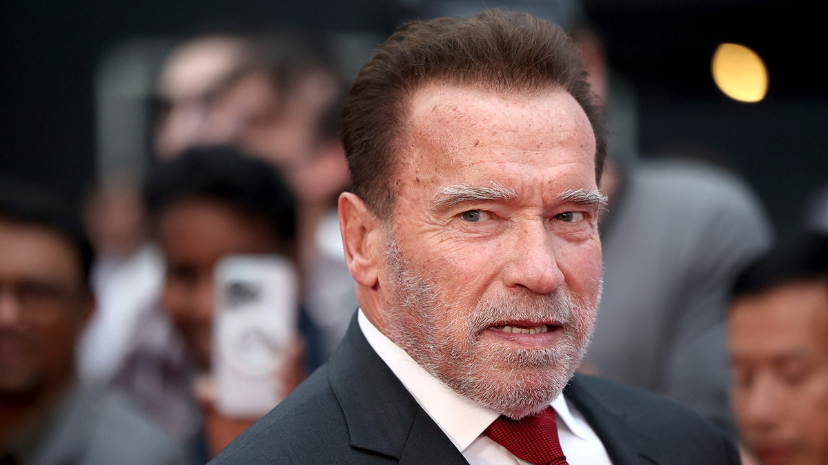Arnold Schwarzenegger looks tense/stoic at the premiere of his show "Fubar"