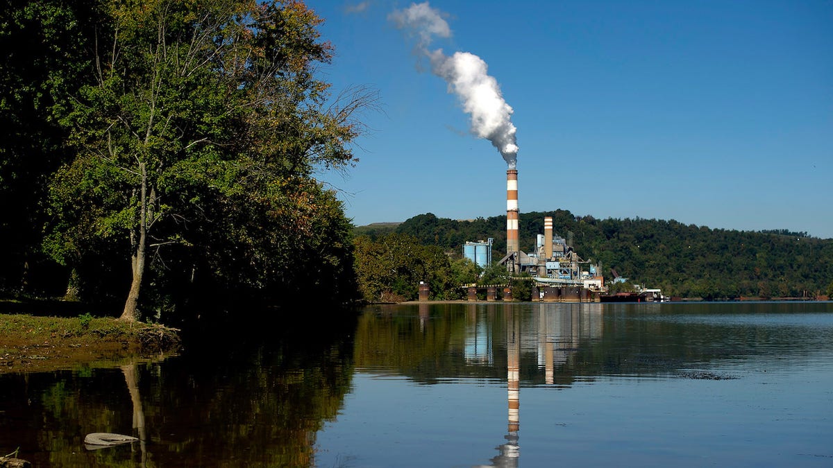 A plume of exhaust extends from the Mitchell Power Station