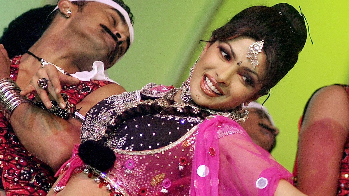 Priyanka Chopra performs in a concert in India wearing a pink outfit in 2003