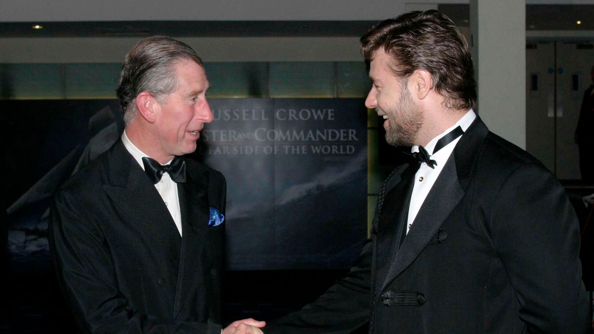 Prince Charles and Russell Crowe shake hands