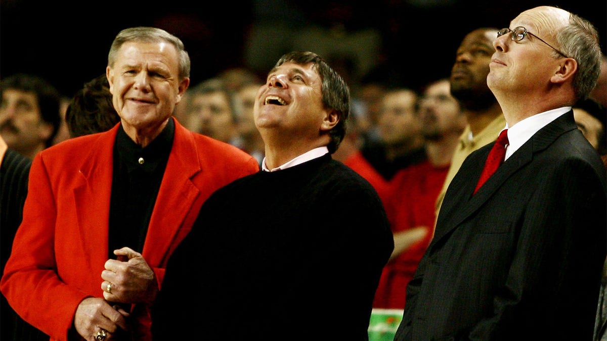 Denny Crum watches a film honoring the head coach