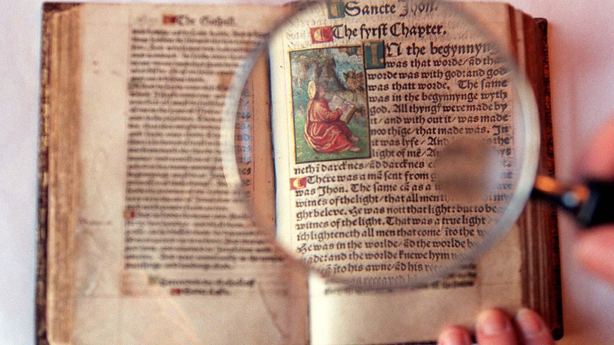 06/10/1536 - On this Day in History - William Tyndale, who was the first man ever to translate the Bible into English, was executed under the orders of King Henry VIII. A magnifying glass highlights the precise script and illustrations in the only complete extant copy of the 1526 edition of William Tyndale's translation of the New Testament, the first ever printed in English from original sources. 