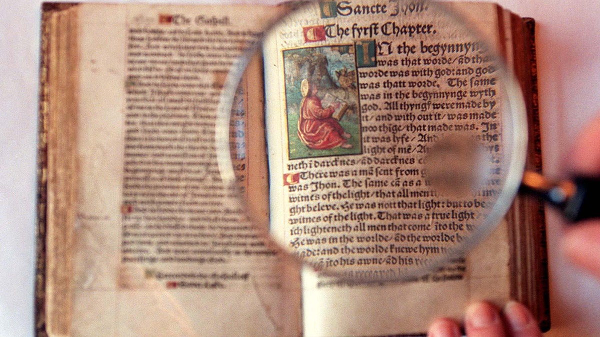 06/10/1536 - On this Day in History - William Tyndale, who was the first man ever to translate the Bible into English, was executed under the orders of King Henry VIII. A magnifying glass highlights the precise script and illustrations in the only complete extant copy of the 1526 edition of William Tyndale's translation of the New Testament, the first ever printed in English from original sources.?