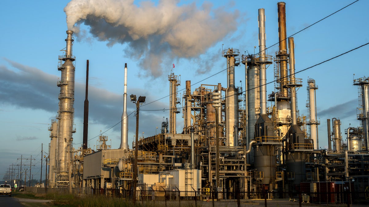 BATON ROUGE, LOUISIANA - OCTOBER 12: Smoke billows from one of many chemical plants in the area October 12, 2013. 'Cancer Alley' is one of the most polluted areas of the United States and lies along the once pristine Mississippi River that stretches some 80 miles from New Orleans to Baton Rouge, where a dense concentration of oil refineries, petrochemical plants, and other chemical industries reside alongside suburban homes. (Photo by Giles Clarke/Getty Images.)