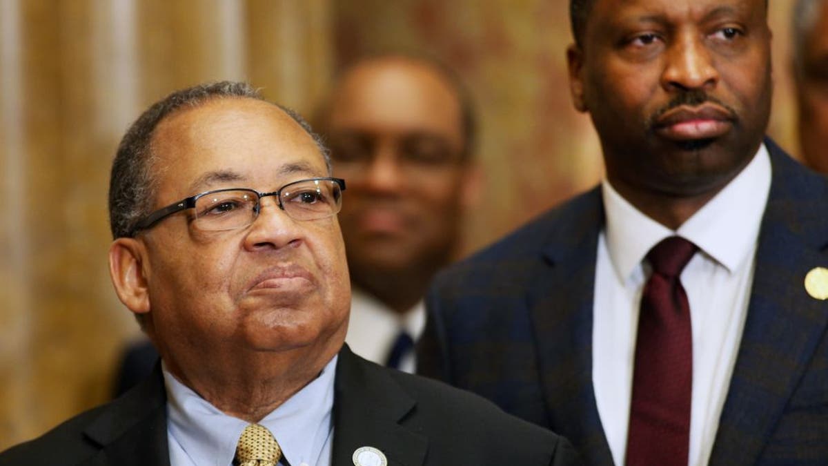 Leon W. Russell, left, NAACP board chairman