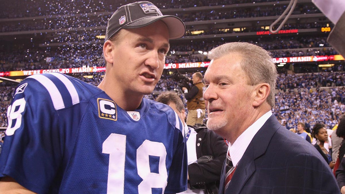 Peyton Manning stands with Colts owner Jim Irsay after winning the AFC Championship in 2010