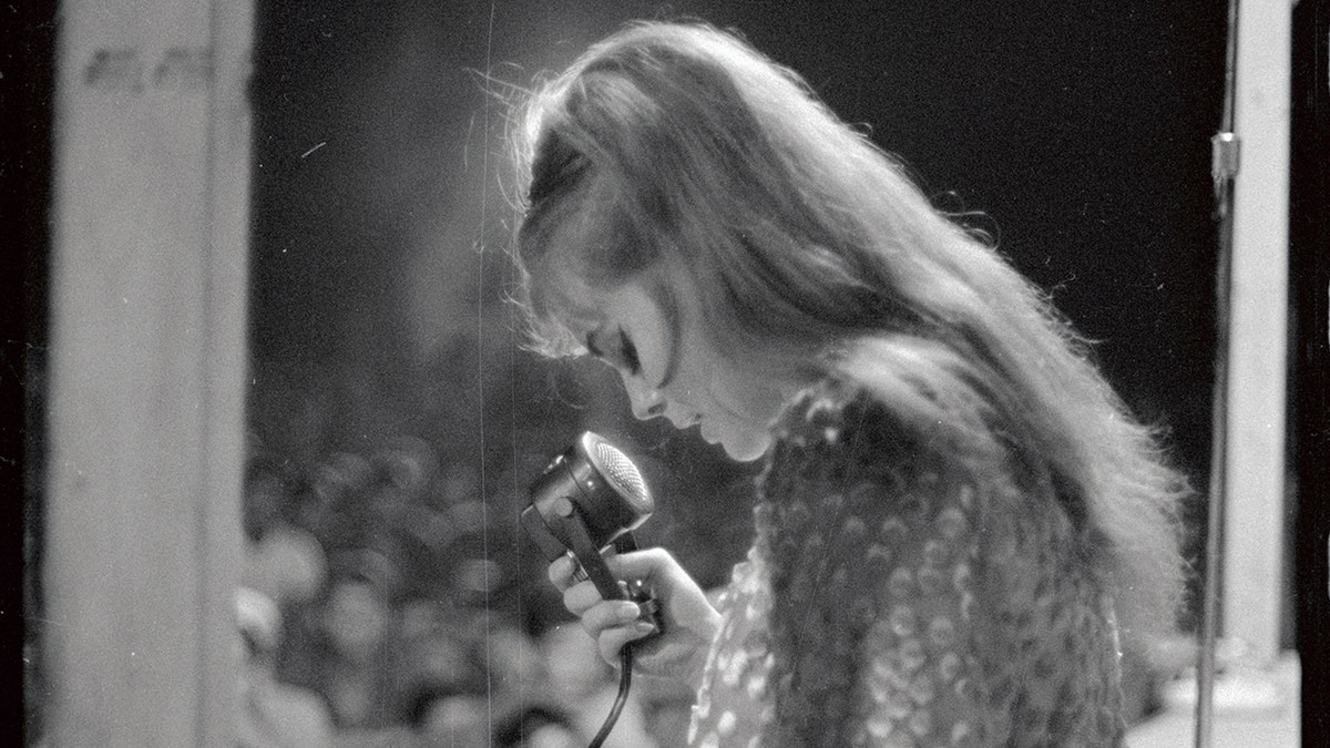 A close-up of Ann-Margret singing to troops