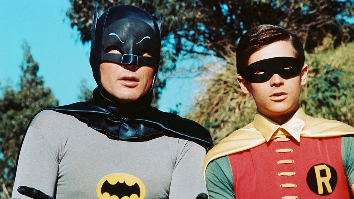 Adam West and Burt Ward in costume as Batman and Robin