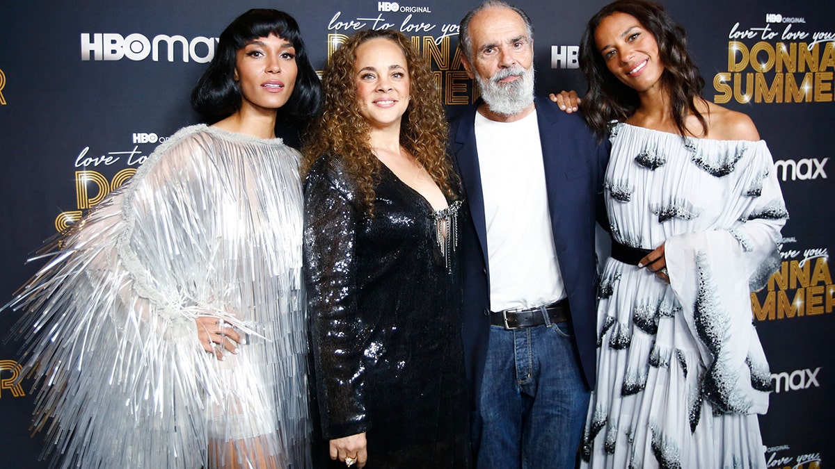 Donna Summers' daughters and widower Bruce Sudano posing