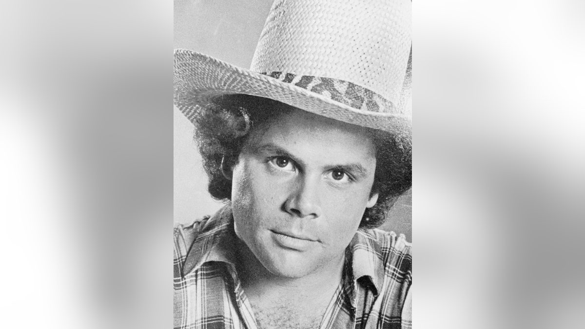 A close-up of Mary Tyler Moores son wearing a cowboy hat