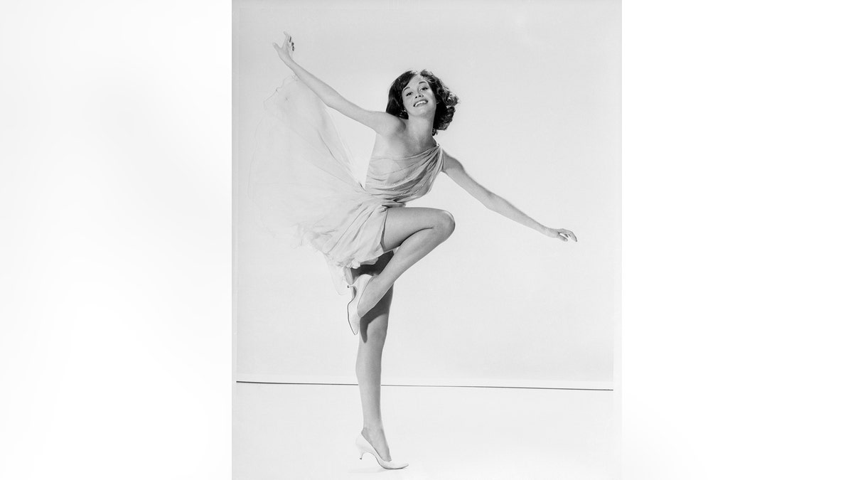 Mary Tyler Moore holding a dancers pose