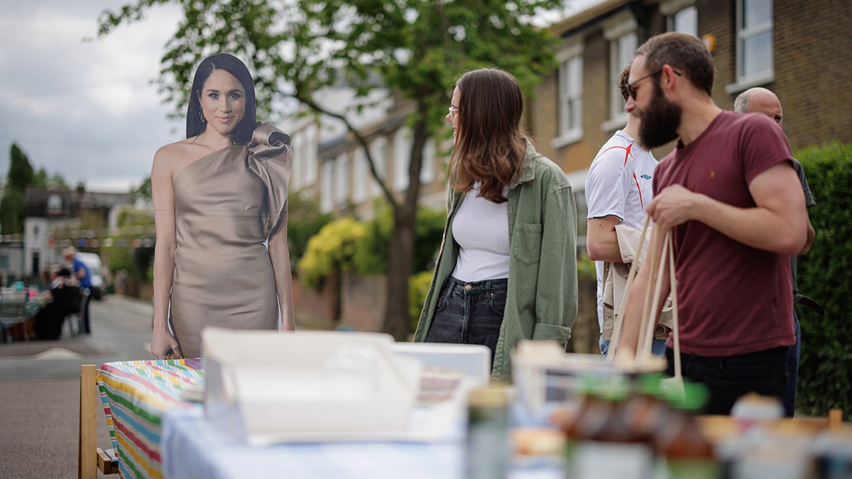 A cardboard cutout of Meghan Markle outside during a coronation lunch