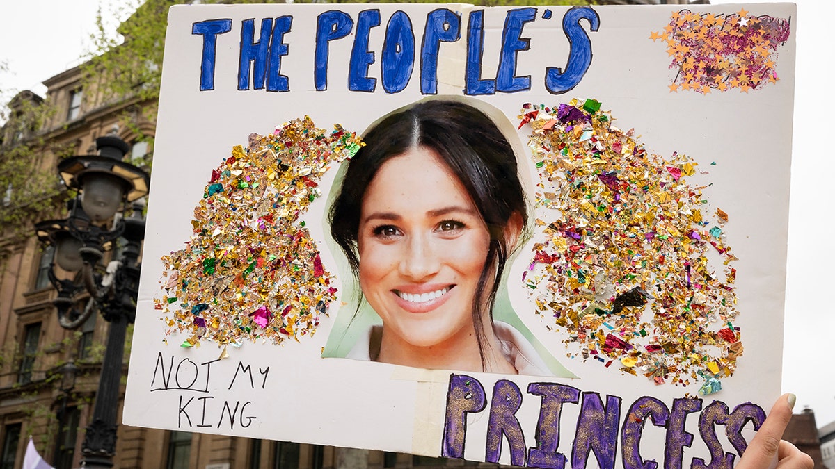 A close-up sign with Meghan Markles face