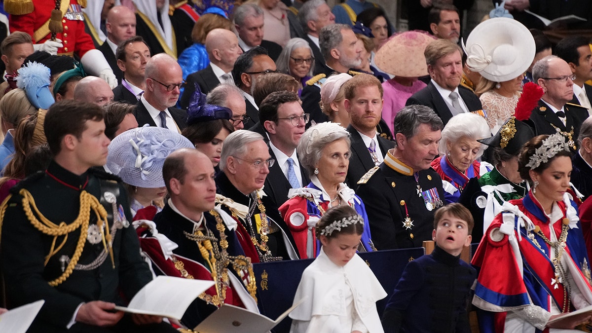 The british royal family sitting together at Westminster Abbey