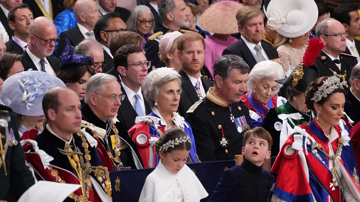 Prince Harry looking in the direction of his older brother Prince William during King Charles coronation