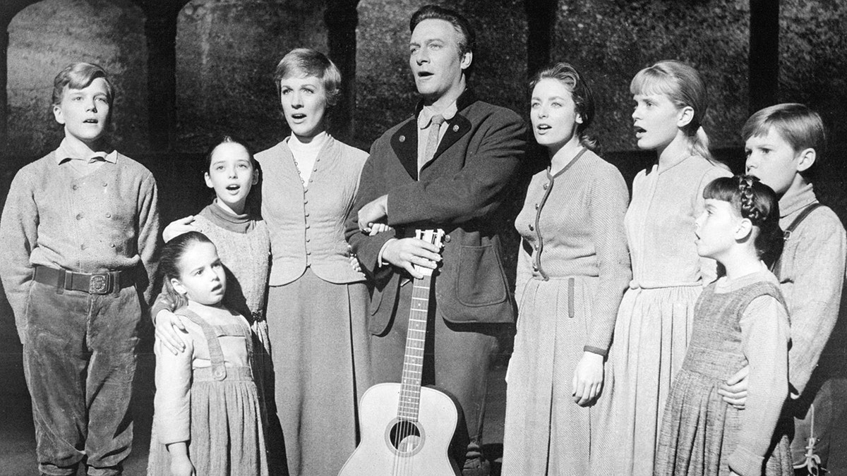 The actors playing members of the Von Trapp family in a promotional portrait for The Sound Of Music,