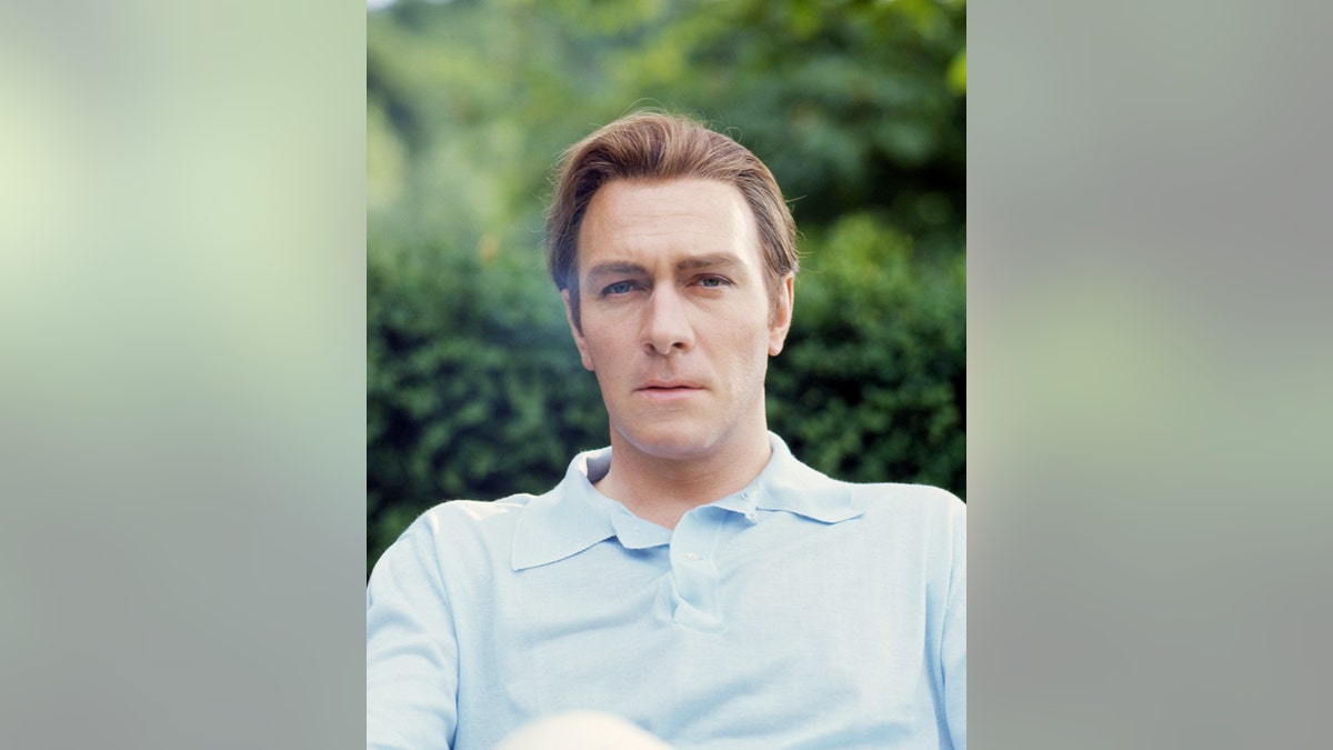 Christopher Plummer wearing a light blue shirt