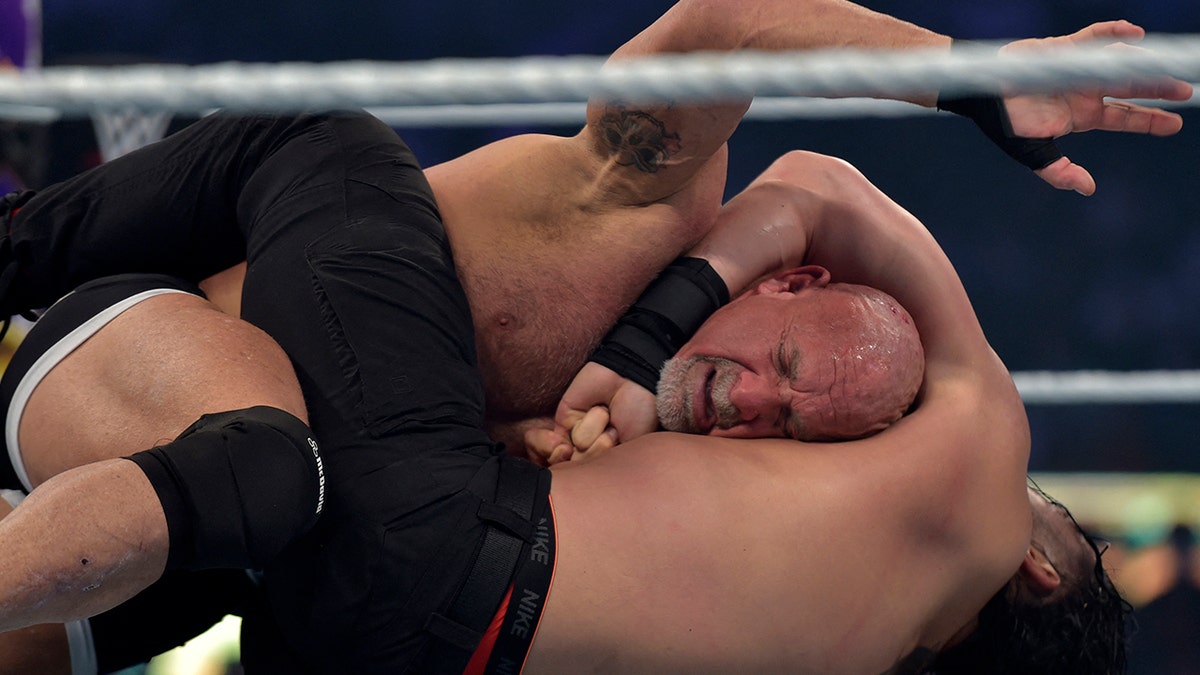 Goldberg vs Roman Reigns